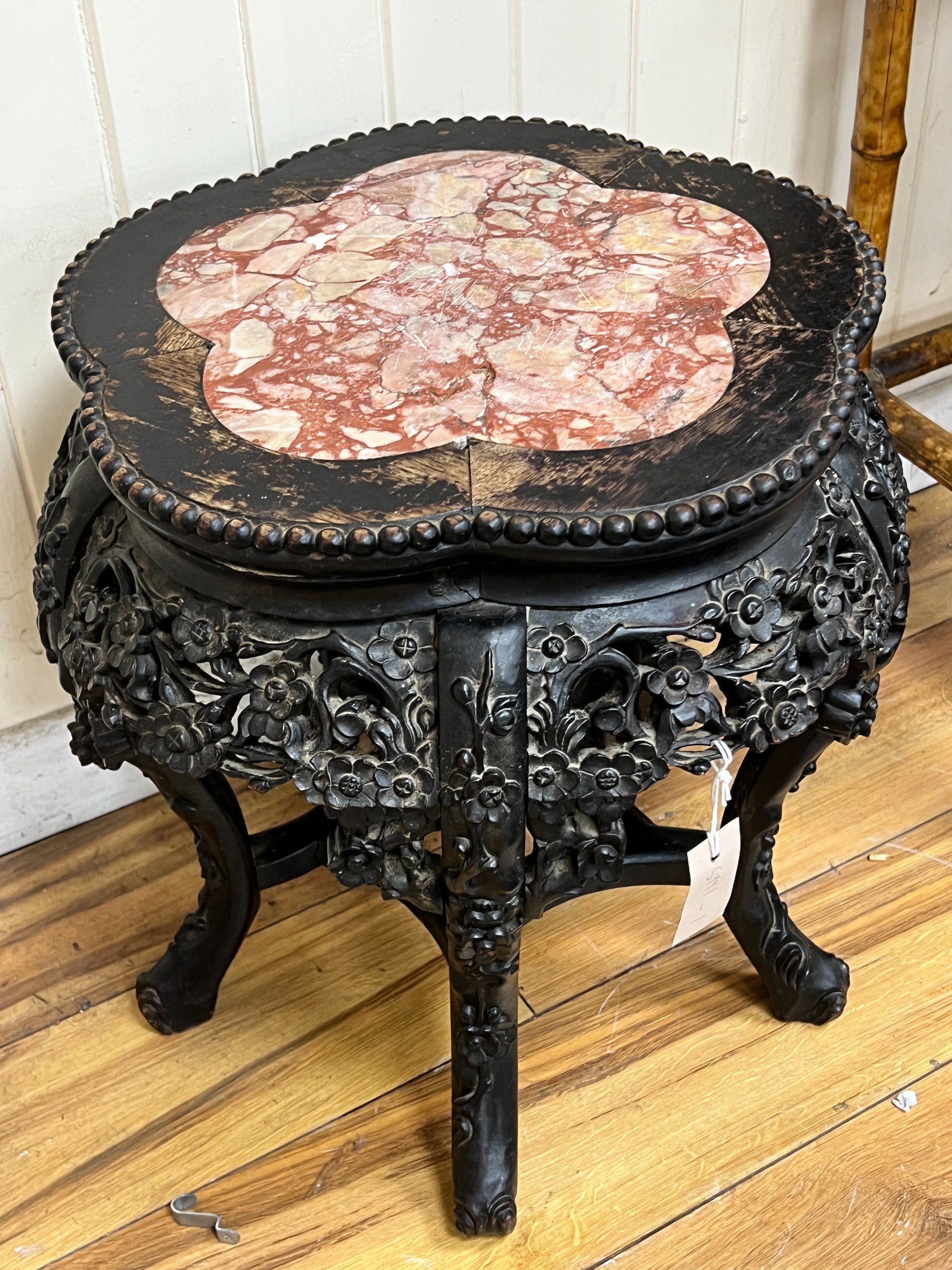 A Chinese carved hardwood marble topped jardinière stand, width 46cm, height 47cm